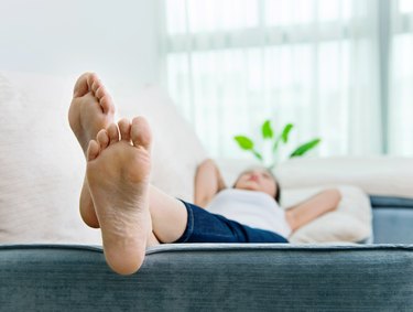 Young woman relaxing on couch