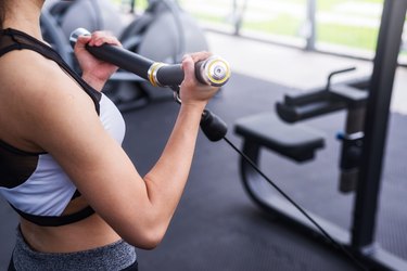 Woman exercise working out in fitness center gym. healthy lifestyle Concept .