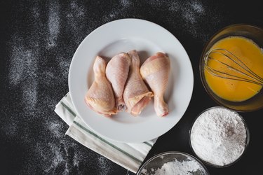 Directly Above Of Chicken In Plate By Ingredients On Table