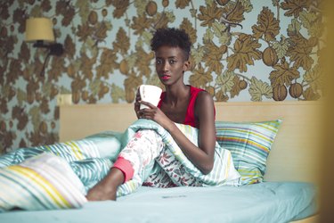 Young woman is looking confidently at camera