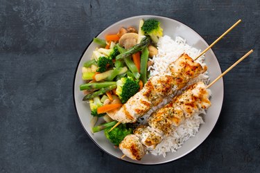 Chicken skewers with steamed vegetables and long rice