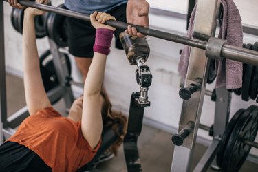 Couple exercising together in gym