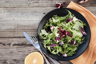 Healthy food. Fresh green salad with spinach,arugula,romaine and lettuce