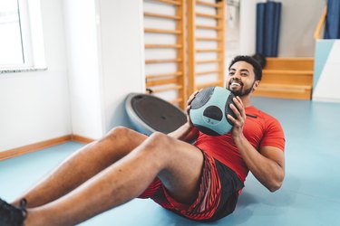 Afroamerican man doing ab exercise