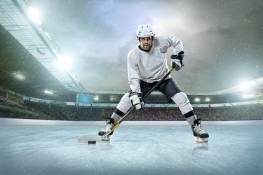 Ice hockey player on the ice. Open stadium