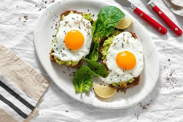 Top view healthy avocado toasts breakfast lunch avocado toast fried eggs white background