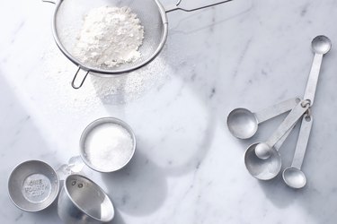 Flour with measuring cups and spoons