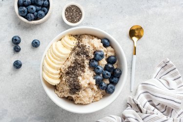 Breakfast oatmeal porridge with fruits, seeds