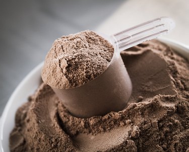 Scoop of chocolate flavor protein powder