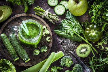 Detox diet concept: green vegetables on rustic table