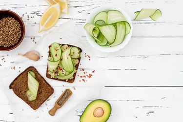 Toast with avocado guacamole and cucumber slices.  Spicy avocado sandwiches