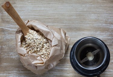 Top view of oats and coffee grinder for making oat flour