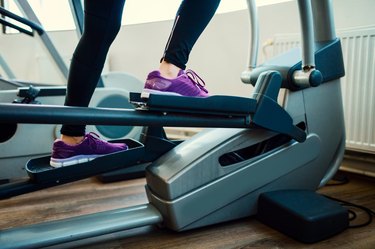 Woman Exercising In Gym.