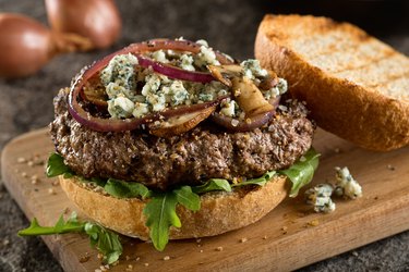 Bison vs beef burger with arugala cheese onions
