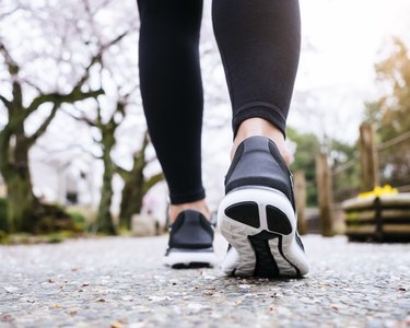 Close view of a woman's legs as she walks 6 miles to lose weight