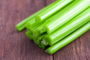 fresh celery on wooden background