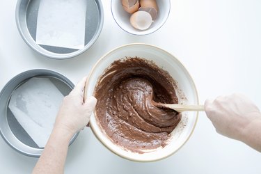 Overhead shot of person mixing ingredients for a cake