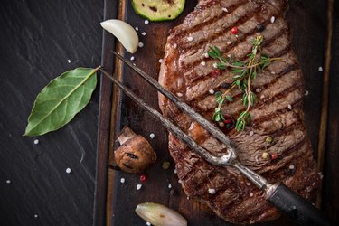 Delicious beef steak on black stone table