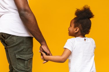 Father and daughter with normal resting heart rate for toddlers holding hands