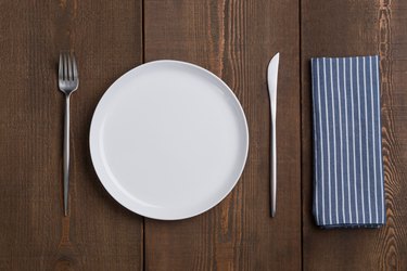 Empty White Plate Table Setting