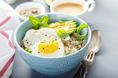 Savory oatmeal with egg and avocado, as an example of a low acid breakfast