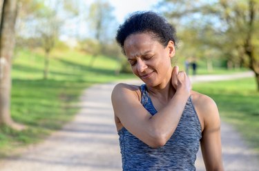 Woman with a pinched nerve in her neck