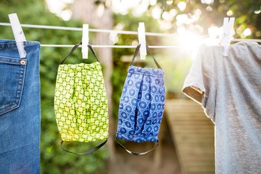 Washable cloth face masks drying on clothes line