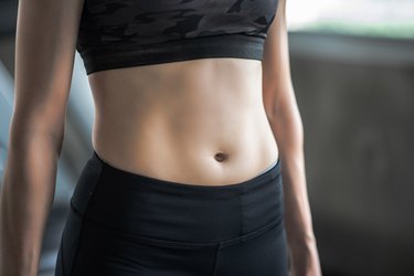 Midsection Of Woman Standing In Gym