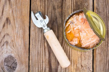 Canned fish salmon or tuna in open metal can