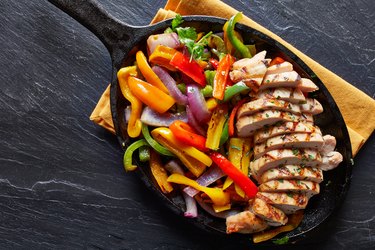 mexican grilled chicken fajitas in iron skillet