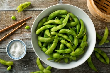 Choline-rich edamame in bowl on wooden table