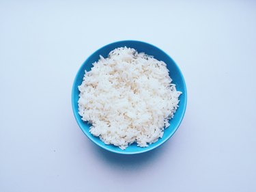 Directly Above Shot Of Rice In Bowl Over White Background