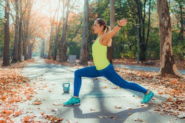 Woman doing HIIT workout in the park.