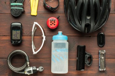Cycling gear and accessories on wooden table