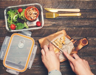 Woman preparing takeaway meal for a 1200-calorie diet plan