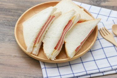 Sandwich with ham cheese on white bread, a refined food bad for heart health
