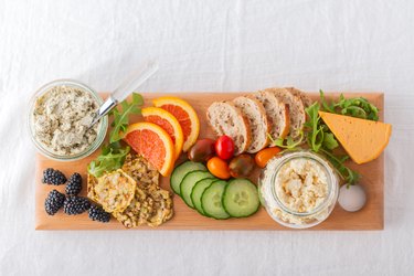 Healthy Vegan Cheese, Fruit, Vegetable, Crackers, Bread on Recycled Board