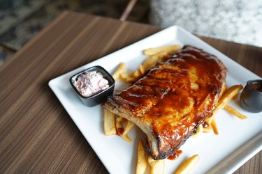Barbecue pork spare rib - Grilled pork baby ribs with spicy bbq sauce served with coleslaw and french fries.