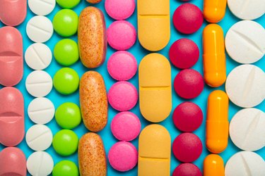 Colorful vitamins on a blue background