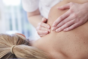 Woman receiving shoulder massage