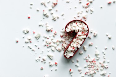 Peppermint In Candy Cane Shaped Pastry Cutter Against White Background