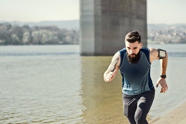 man running outdoors along a river in a virtual race