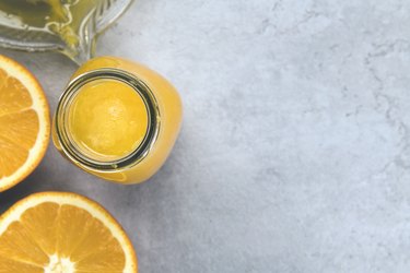 Bottle of fresh orange juice from above
