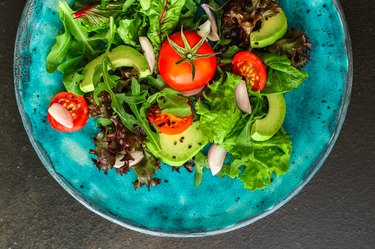 salad healthy, vegetables (avocado, tomato, mix leaves, arugula, lettuce, onions and more) top menu concept. food background. copy space