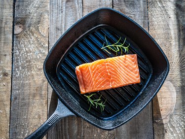 Fresh raw salmon steak on cooking pan