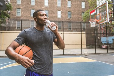 Basketball player training outdoors