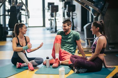 Group of people discussing workout.