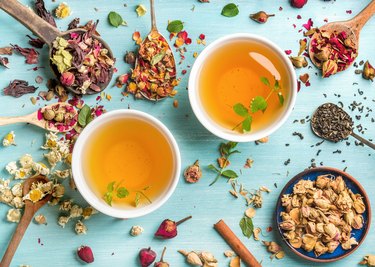 Two cups of healthy herbal tea with mint, cinnamon, dried