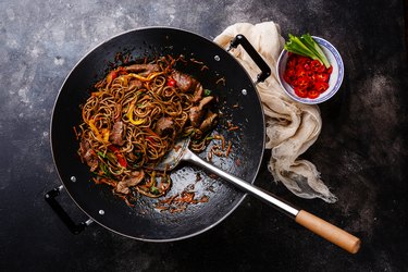 Stir-fry soba noodles with beef and vegetables and cooking oil
