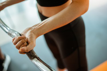 young fitness asian woman exercise with  barbells in gym for building muscles.exercising concept.fitness and healthy lifestyle